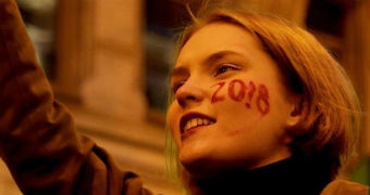 Side shot of woman with 2018 face paint on her cheek