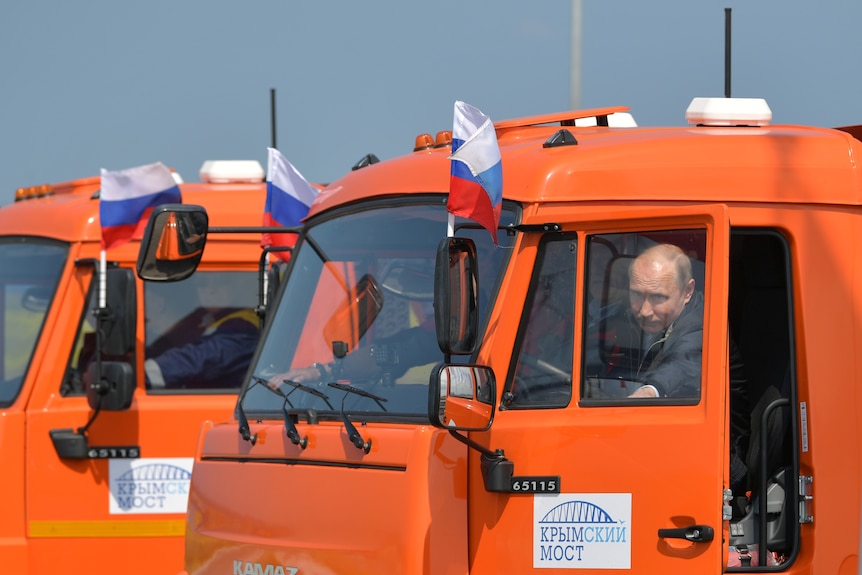 Vladimir Putin in an orange truck