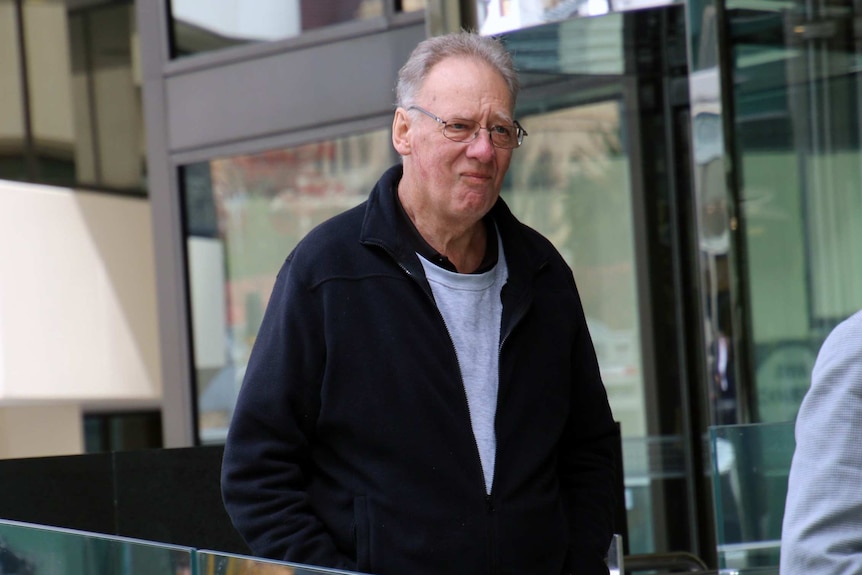 Philip Hooper walking outside the Coroner's Court.