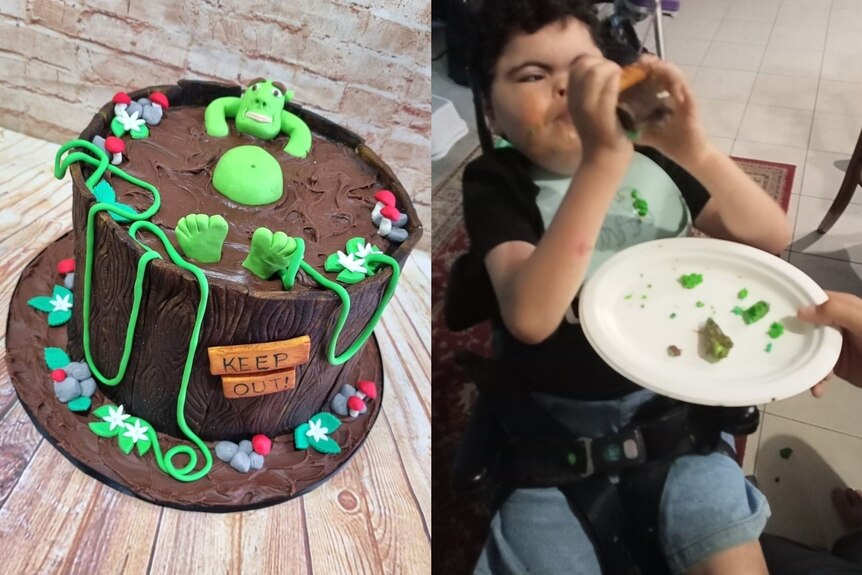 A boy in a wheelchair eats a brown cake.
