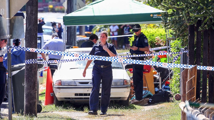 Police attend a crime scene after eight children were found dead
