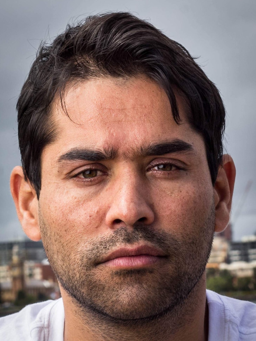 Abdul Basiry sits next to Newcastle Harbour.