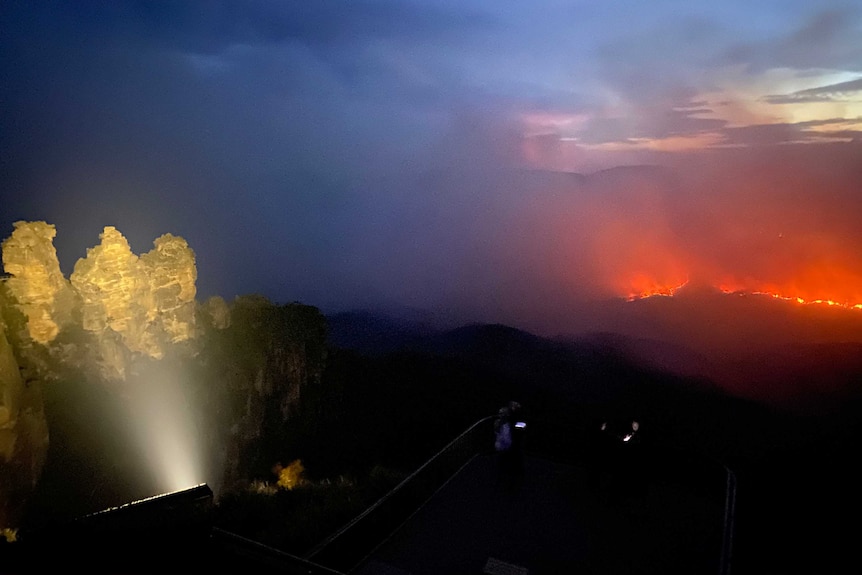 fire burning on mountainside bushland