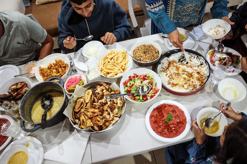 lots of plates with food on a table