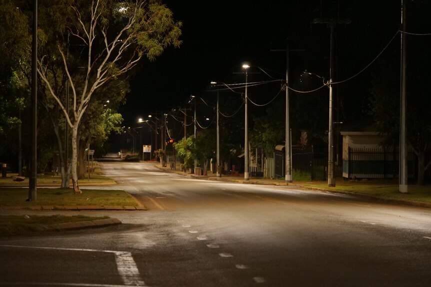 A well-lit but empty street at night