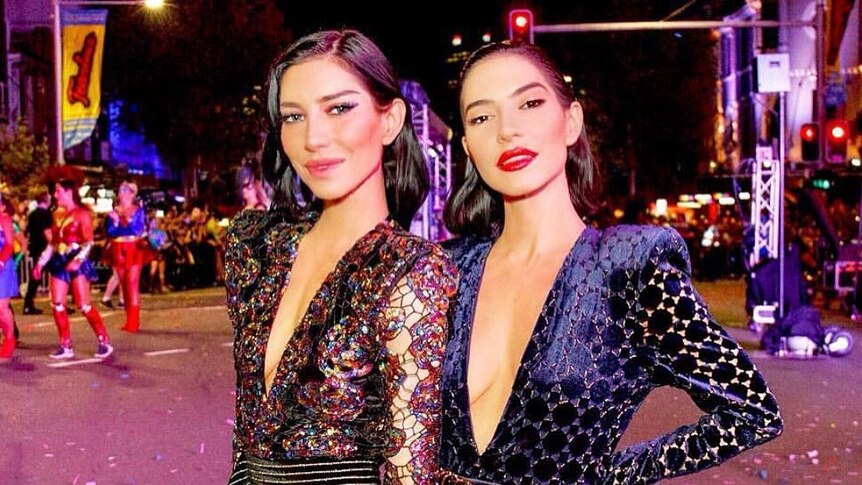 The Veronicas stand in the street at the Mardi Gras parade