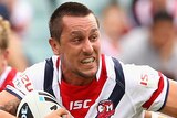 Roosters half-back Mitchell Pearce is tackled against Canberra in March 2012.