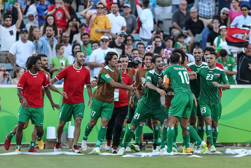 Iraq celebrates Younus Mahmood's goal in the Asian Cup quarter-final against Iran