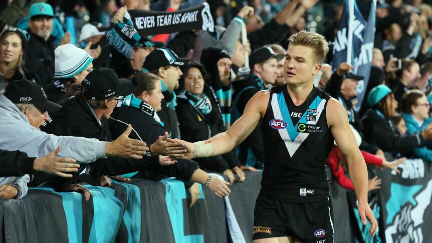Port Adelaide's Ollie Wines is congratulated by fans after the Power's win over Western Bulldogs