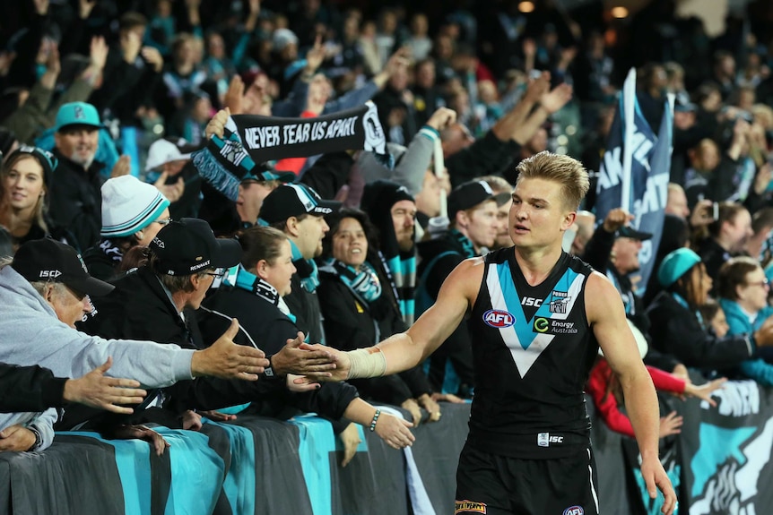 Port Adelaide's Ollie Wines is congratulated by fans after the Power's win over Western Bulldogs