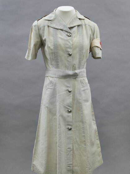 A grey Australian Army nurses uniform on mannequin, from 1940s