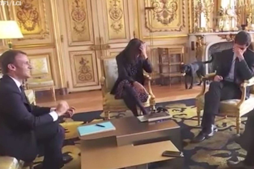 Emmanuel Macron, Brune Poirson and Julien Denormandie laugh after Nemo the dog urinates on a fire place.