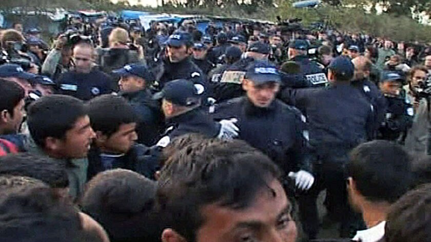 French riot police clashed with human rights activists at the makeshift migrant camp.