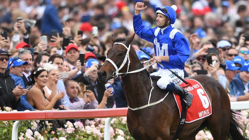 Jockey Hugh Bowman reacts after he rode Winx to victory in the 2018 Cox Plate at Moonee Valley.