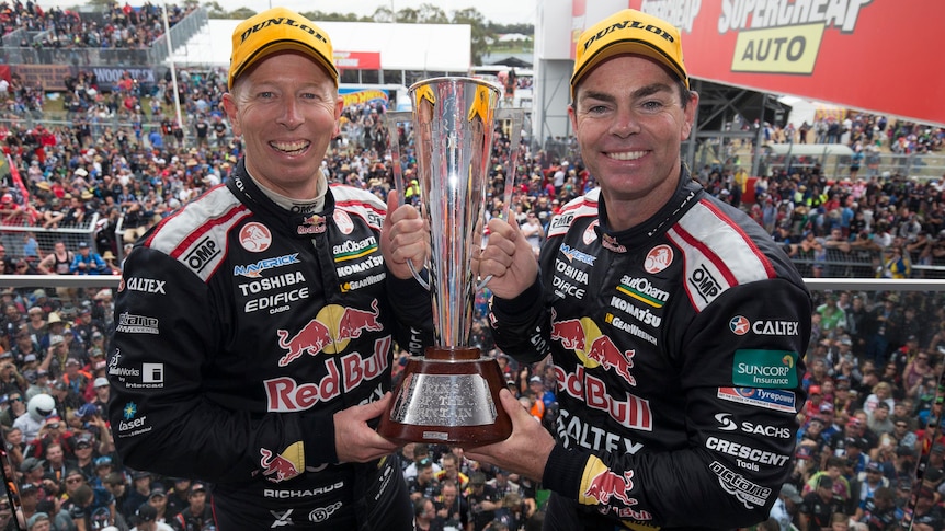 Steve Richards and Craig Lowndes celebrate with Bathurst trophy