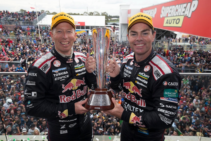 Steve Richards and Craig Lowndes celebrate with Bathurst trophy