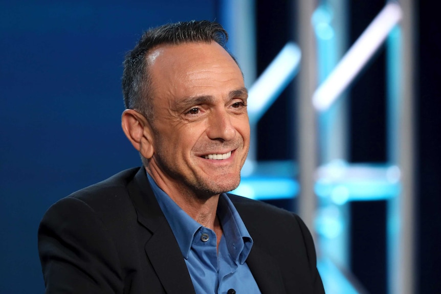 Simpsons voice actor Hank Azaria smiles during an event.