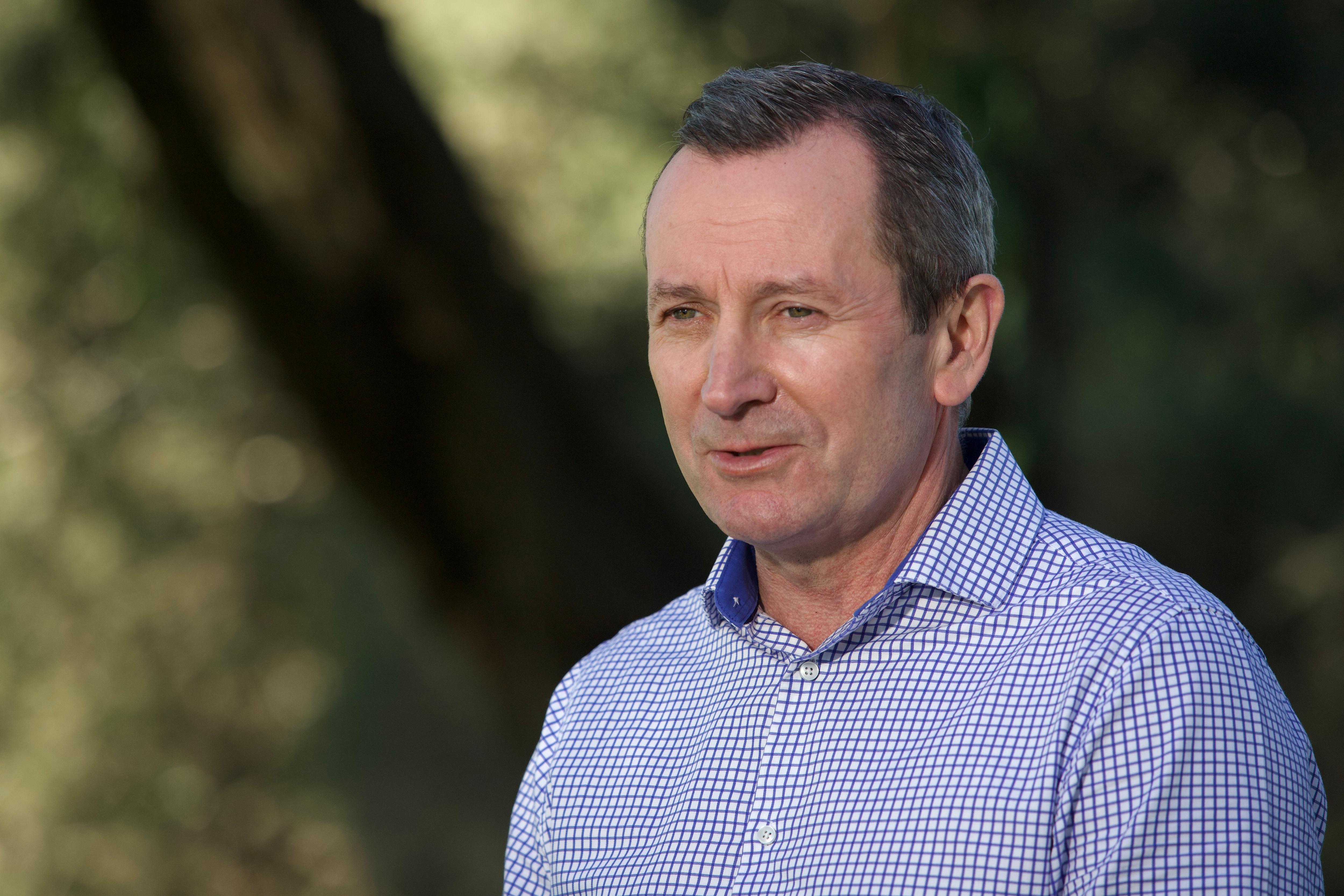 A man with a blue checked shirt