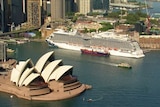 A cruise ship with the Opera House in the foreground