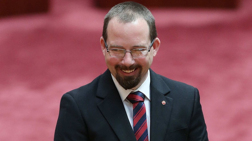 Ricky Muir photographed candidly smiling off camera
