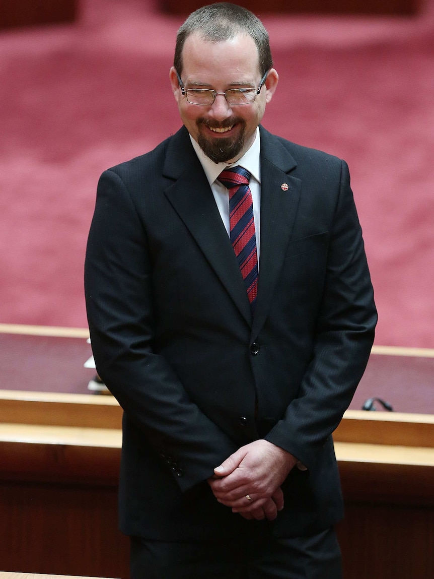 Ricky Muir photographed candidly smiling off camera