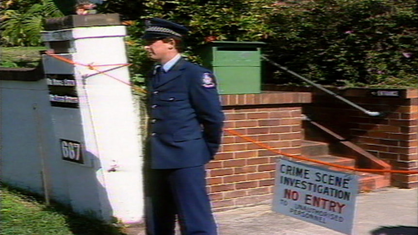 A police officer stands guard outside a Brisbane abortion clinic during raids in 1985.