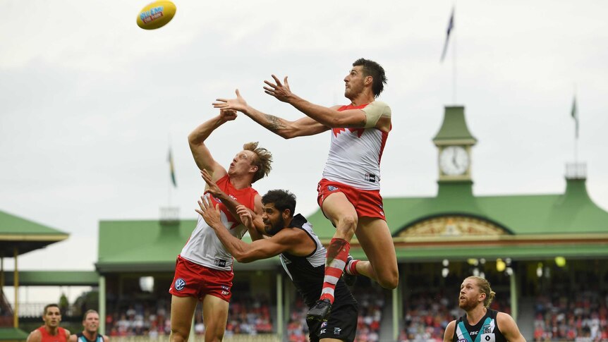 Sam Naismith goes up for a mark at the SCG