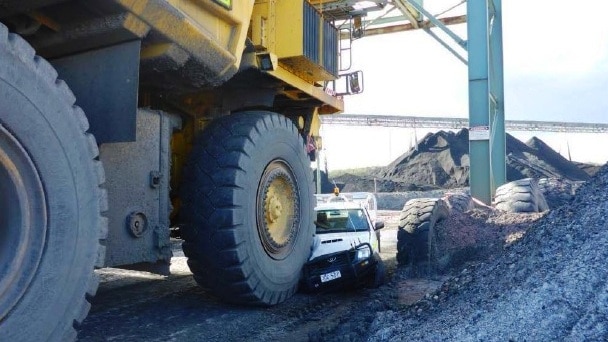 Ashton mine dump truck partly crushing utility