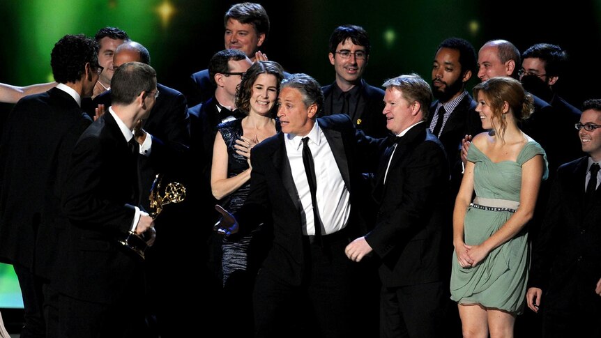 The cast of Daily Show With Jon Stewart accept their award at the Emmys
