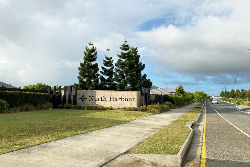 Stone wall with sign for North Harbour, a residential and marina development