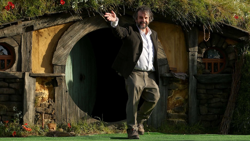 Peter Jackson emerges from from a Hobbit house before giving a speech at the premiere of The Hobbit: An Unexpected Journey.