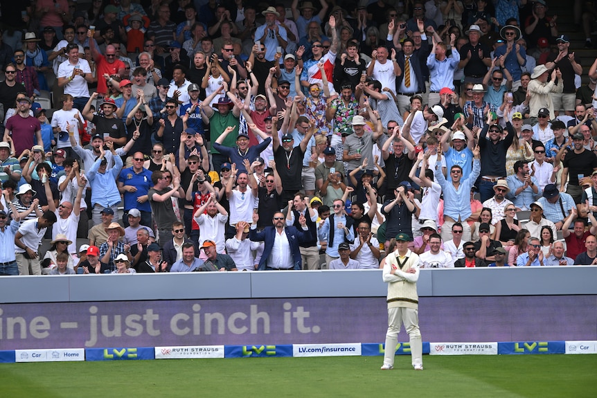 Australia fielder Matt Renshaw stands in front of cheering English fans during an Ashes Test at Lord's