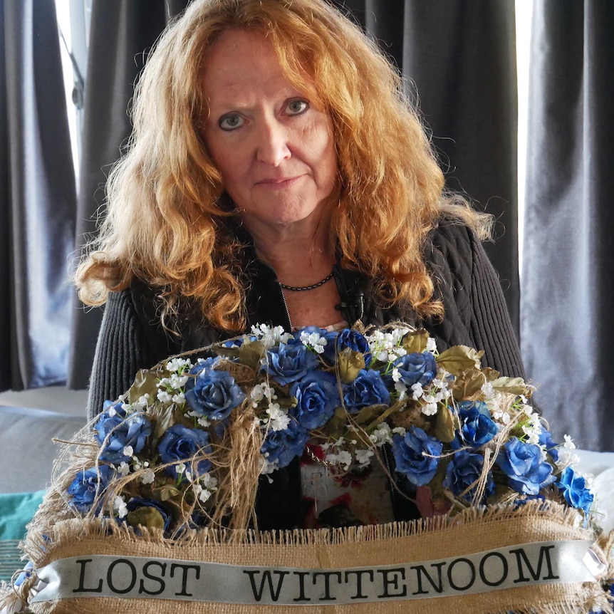 Lyniece Bolitho poses with a bouquet of flowers