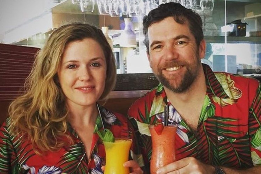Australian actors Harriet Dyer and Patrick Brammell sip cocktails while wearing tropical shirts