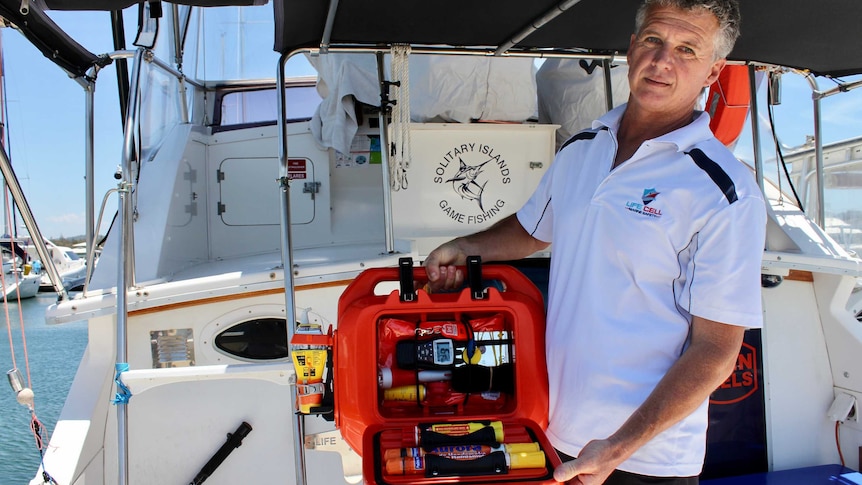 Scott Smiles holds one of the Life Cells on a yacht at the Coffs Harbour marina.