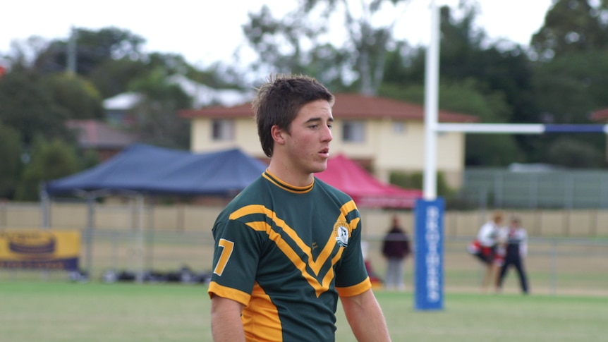 Ben Hunt as a young man in a green and gold St Brendan's College uniform on a rugby pitch
