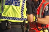 NT Police officer and NT Fire and Rescue officer at scene