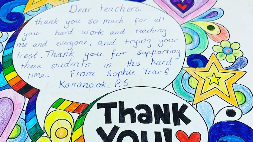 A colourful card with printed stars, flower and hearts written on by a child thanking teachers.