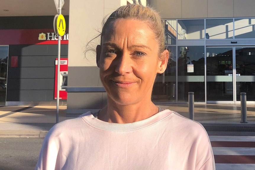 Tracey Laurie stands outside the Noosa Civic Shopping Centre.