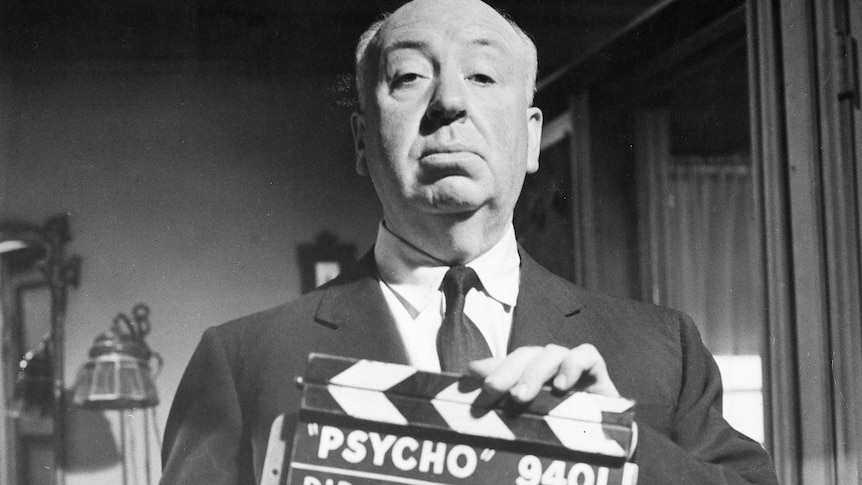 Alfred Hitchcock with Psycho clapper board