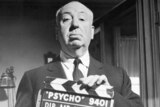 Alfred Hitchcock with Psycho clapper board