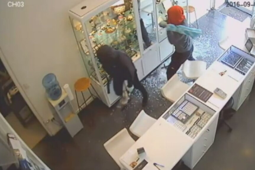 Two armed men smash their way through an Elsternwick jewellery store