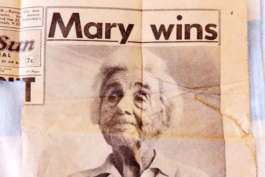 A black-and-white newspaper clipping with a photograph of Mary Ann Campigli and the headline 'Mary wins'.