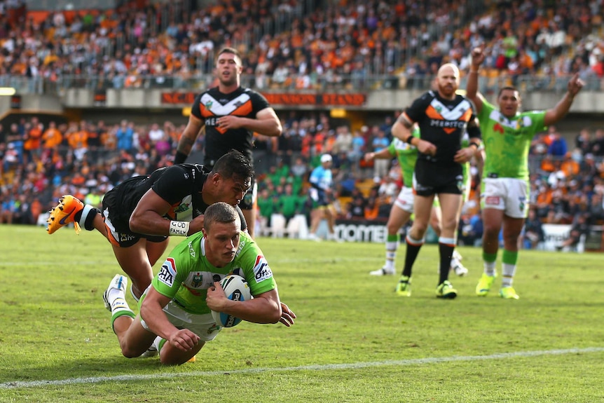 Jack Wighton scores a try against the Tigers