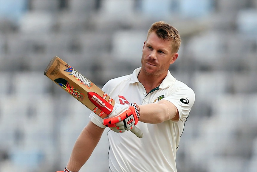 David Warner points to the stands after a century in Bangladesh