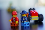 Two pieces of LEGO people talking to each other.