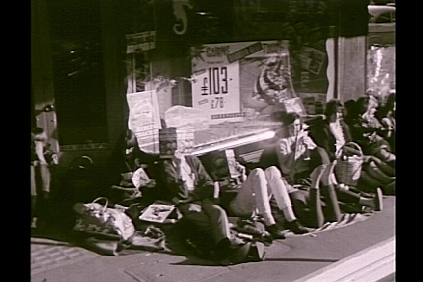 Archival image of fans waiting for the Beatles in 1964