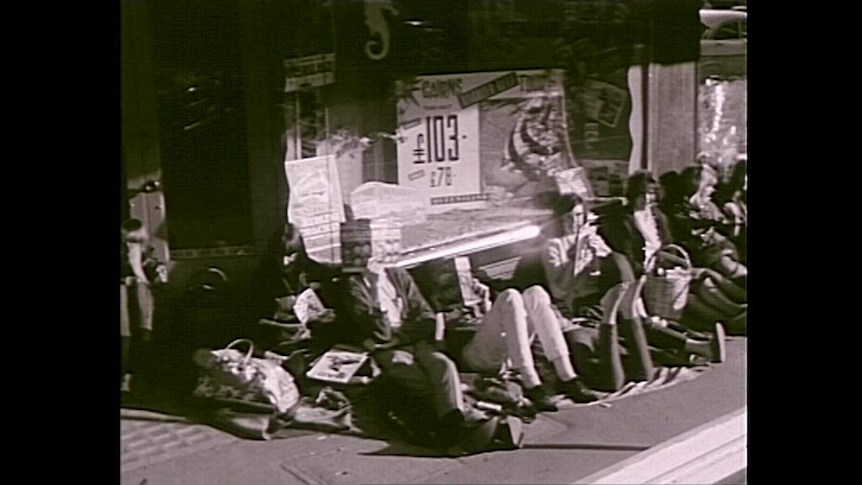 Archival image of fans waiting for the Beatles in 1964