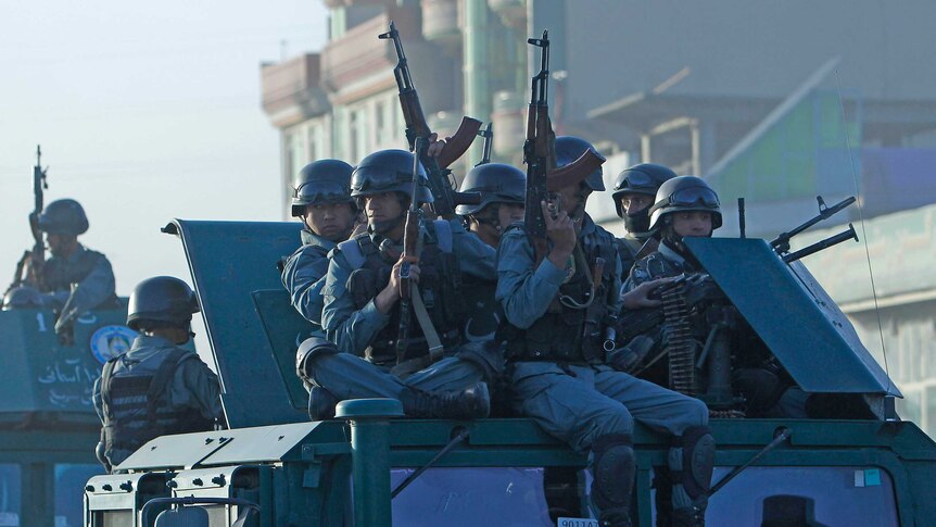 Afghan police arrive at the site of an attack in Kabul
