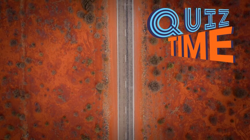 An aerial view of a road in the middle of the outback.